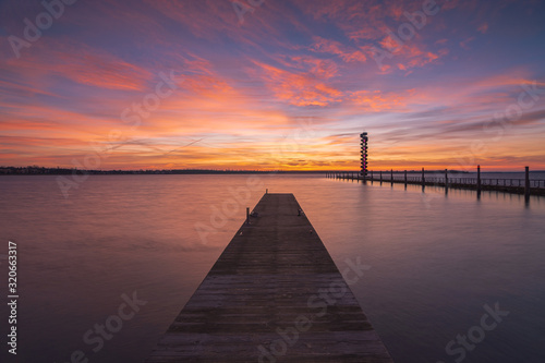 Fototapeta Naklejka Na Ścianę i Meble -  Soft and colorful sunrise at the pier