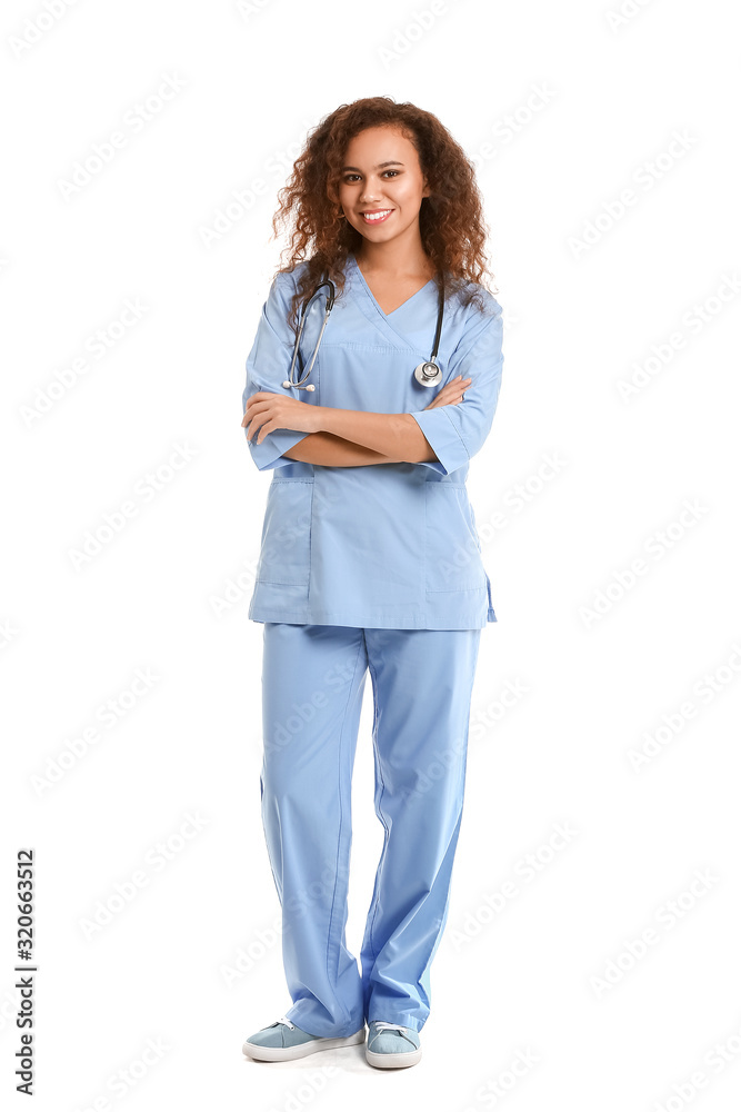 Young African-American nurse on white background
