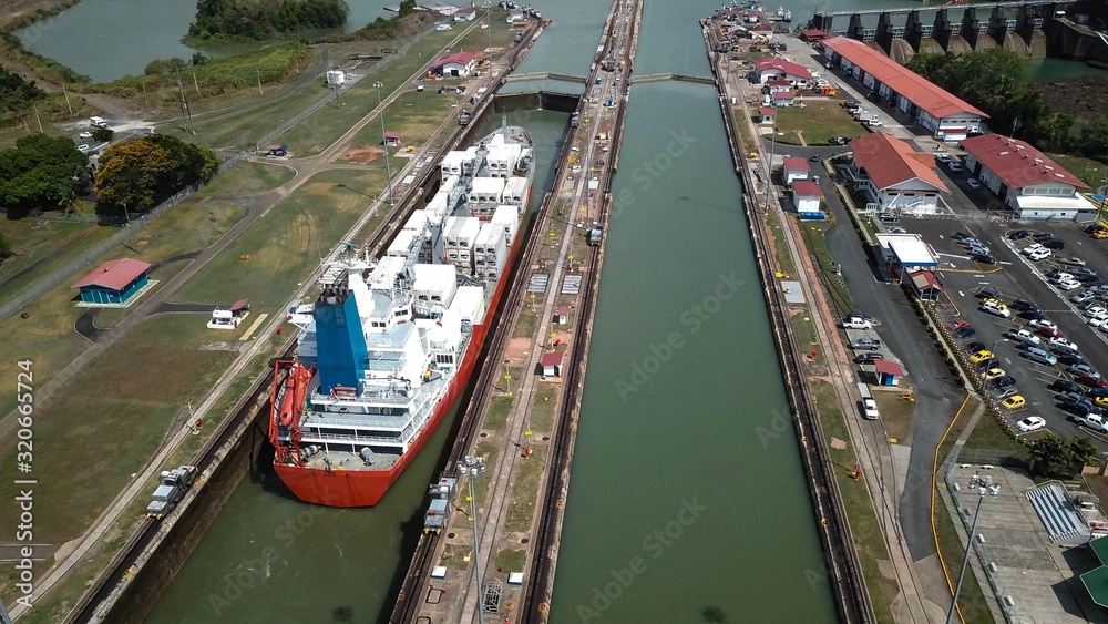Aerial view of Panama channel - Miraflores locks - ship crossing the Panama Canal