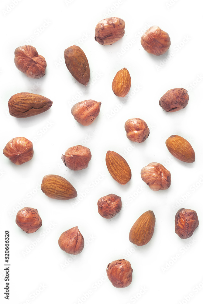 pile of almonds and nuts isolated on white background pile of almonds and nuts isolated on white background