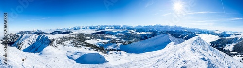 beautiful mountain panorama snow covered swiss alps. panoramic picture of the snowy mountains in switzerland © Simon