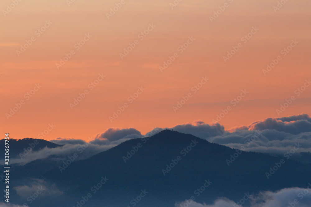 Beautiful sunset with colorful sky and many clouds over the mountains - landscapes in Guatemala