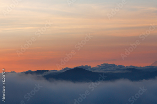 Beautiful sunset with colorful sky and many clouds over the mountains - landscapes in Guatemala © Fernanda