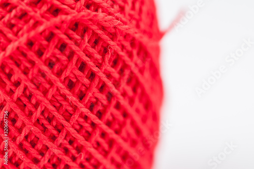 Red thread isolated on white background. Copy space.