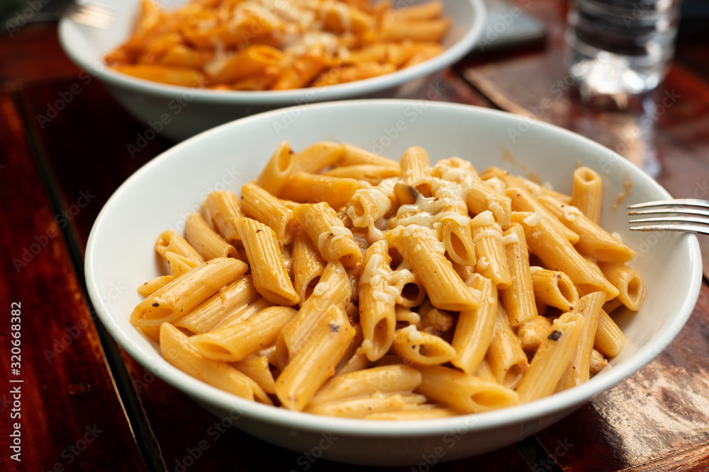 Penne with Mushroom Cream in Isolated Black Background Penne with Mushroom Cream in Isolated Black Background