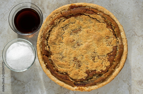 Freshly baked shoofly pie with sugar and molasses. Shoofly pie is a molasses pie or cake that developed its traditional form or recipe among the Pennsylvania Dutch in the 1880s. photo