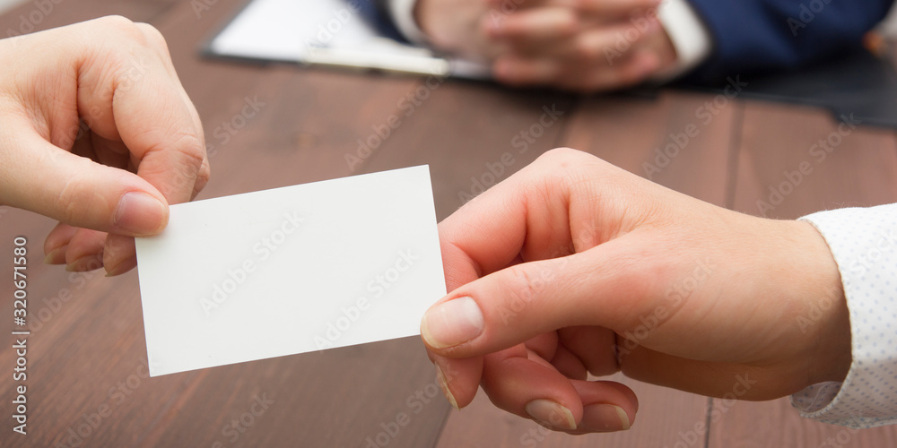 Obraz premium business executive exchanging business card blank. Copy space