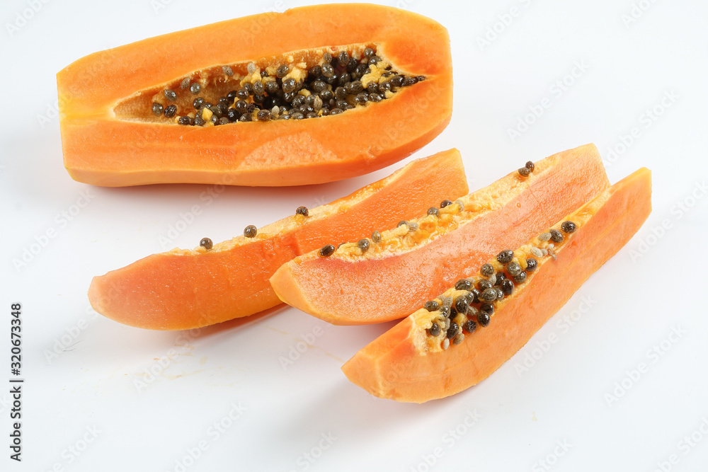 Half and slices papaya isolated on white. Half and slices papaya isolated on white.