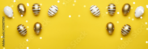 Happy Easter golden shine decorated eggs in basket isolated on yellow background. For greeting card, promotion, poster, flyer, web-banner, article