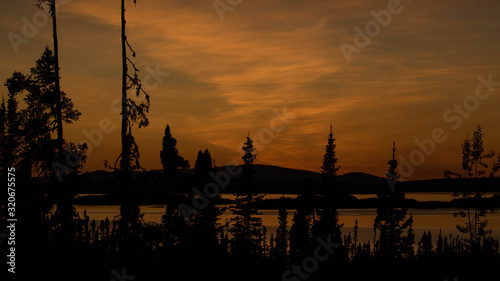 landscape of a sunset. Lake Manicouagan in Quebec. Mountain landscape with lake photo