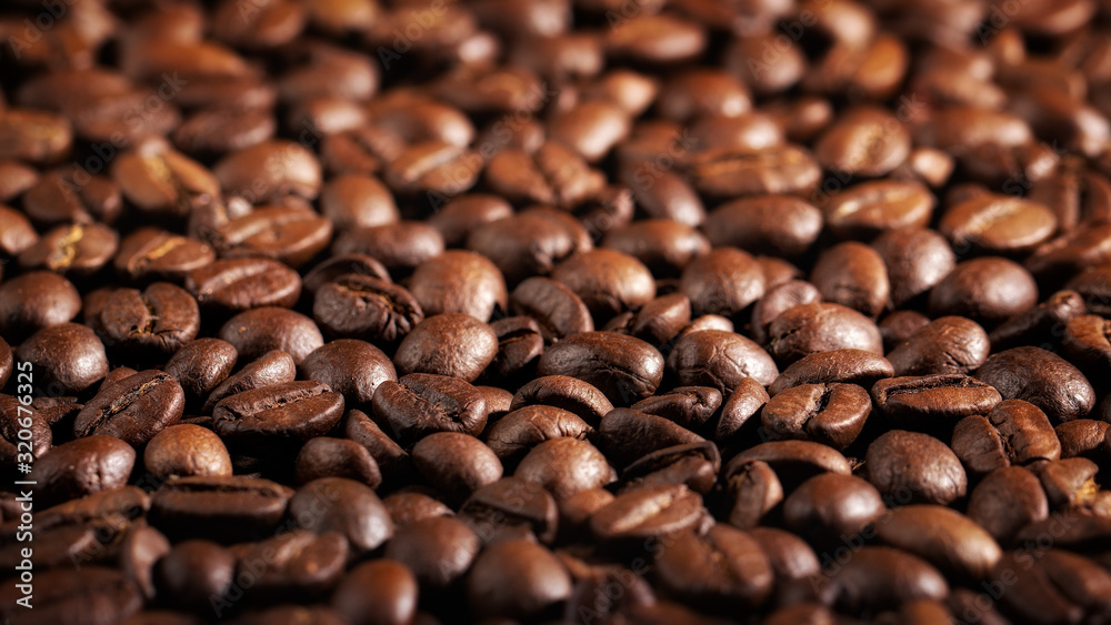 Fototapeta premium Texture of coffee seeds, selective focus, close-up