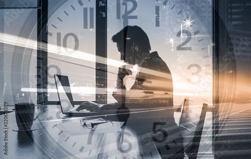 Businessman working on computer at the office. Success, networking, business time management concept. 