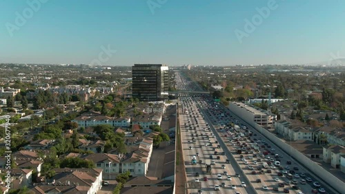 Aerial view of freeway traffic on I-405 interstate in urban Los Angeles with cars below during the day. photo