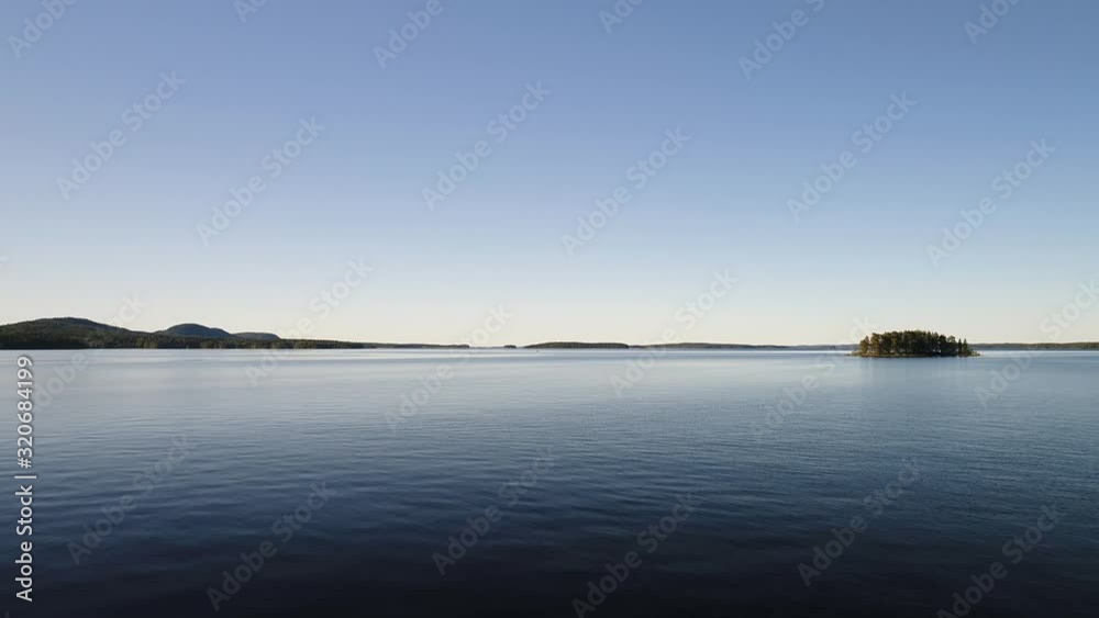 Aerial Flight to Finnish Lake with Tree Island Aerial Flight to Finnish Lake with Tree Island