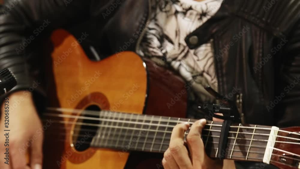 Close up of man's hands playing acoustic guitar. Musical instrument for recreation or hobby passion concept. Close up of man's hands playing acoustic guitar. Musical instrument for recreation or hobby passion concept.
