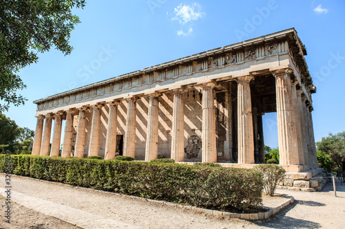 The temple of Hephaestus In ancient market agora under the rock of Acropolis. Athens, Greece.