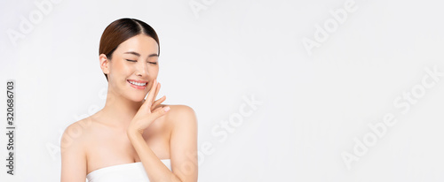 Beautiful bright skin smiling Asian woman on banner background
