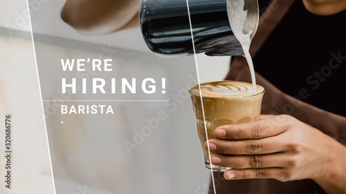 WE'RE HIRING text with barista making latte art coffee in background