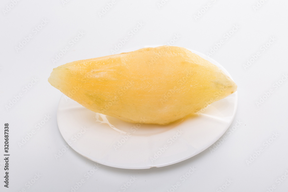 Smallanthus sonchifolius on the white plate, he in the white background, is a nutritional health of the wild plant fruit, pharyngeal inhibition