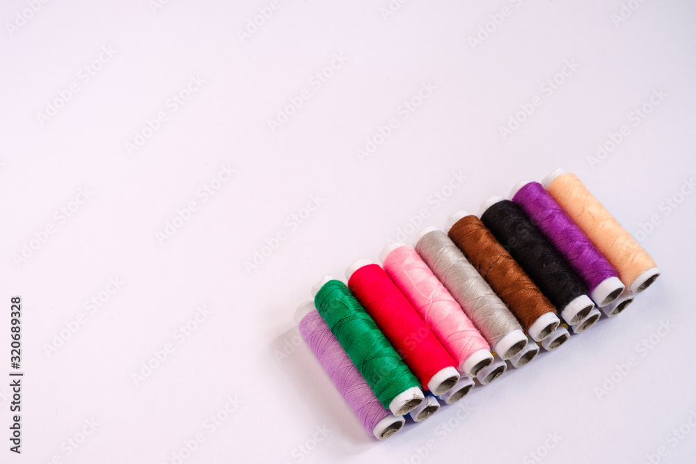 Thread on white background with copy space Thread on white background with copy space