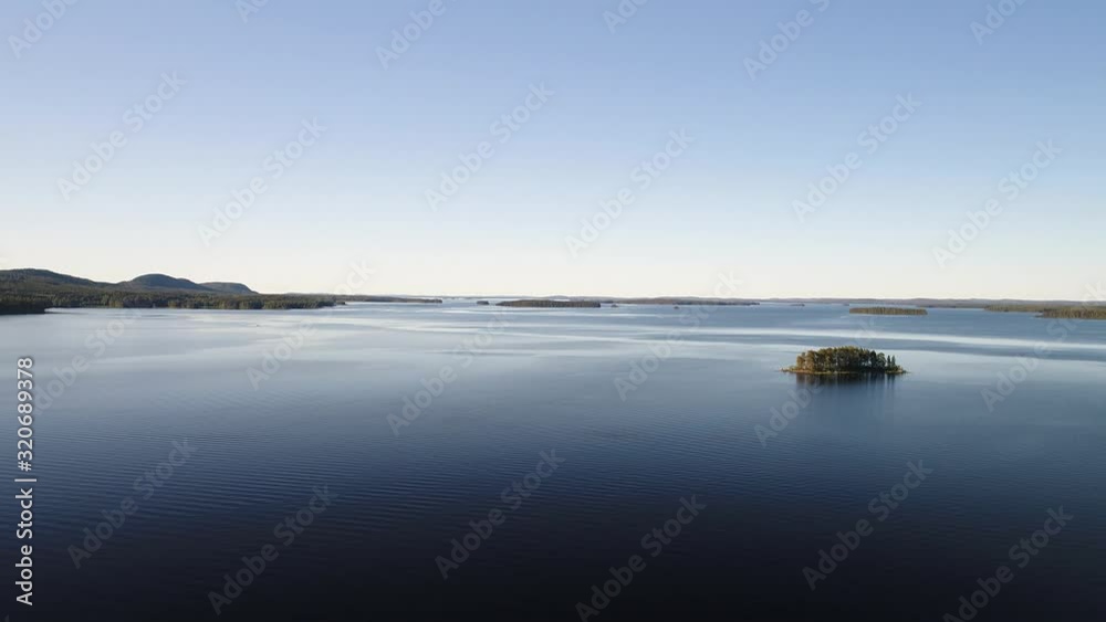 Aerial Flight to Finnish Lake with Tree Island Aerial Flight to Finnish Lake with Tree Island