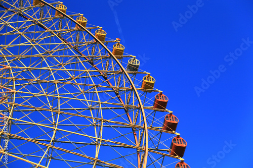 Ferris Wheel part shot with blue sky background at Osaka, Japan