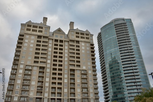 Two high rise condominium towers with an overcast sky