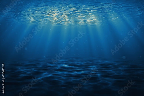 Dark blue ocean surface seen from underwater. Abstract waves underwater and rays of sunlight shining through. 3D illustration