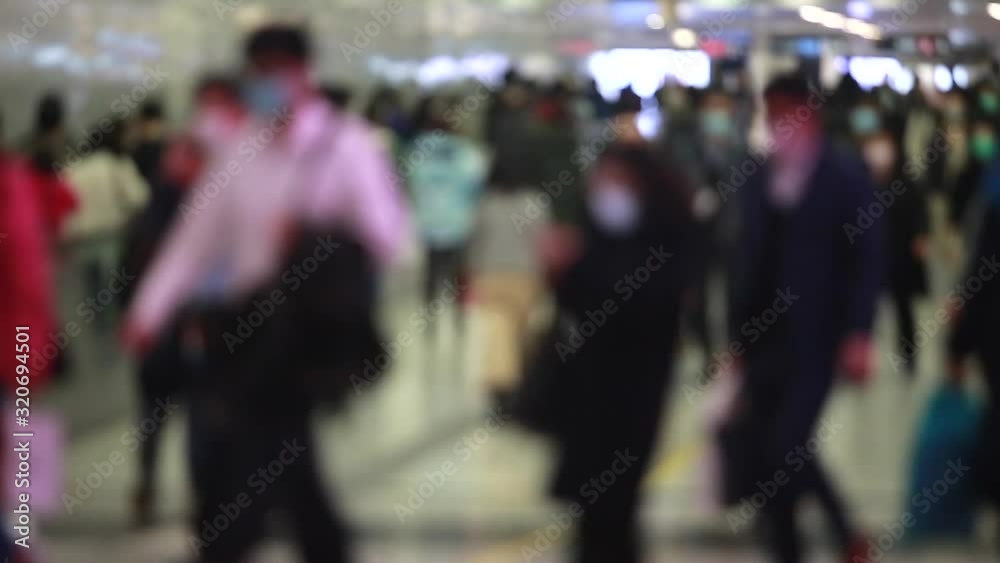blurred masked people with motion in Hong Kong under the Threat of wuhan coronavirus blurred masked people with motion in Hong Kong under the Threat of wuhan coronavirus