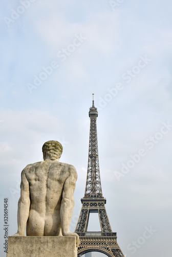 Statue in Paris and the Torre Eiffel