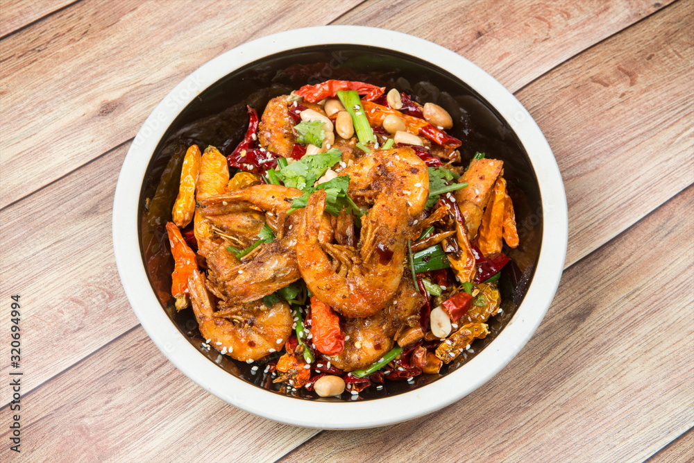 This is an Asian cuisine where you take the shrimp and you fry it, you add the chili, the white sesame, the sichuan peppercorn and then you pour the beer inside This is an Asian cuisine where you take the shrimp and you fry it, you add the chili, the white sesame, the sichuan peppercorn and then you pour the beer inside