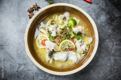 This is a famous dish in chengdu, sichuan province, China. It is called clear sweet sour and hot fish. It is mainly made of lemon, pepper, grass carp, green pepper and chicken soup