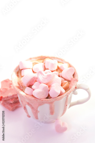 strawberry pink color hot chocolate with heart shaped marshmallows 