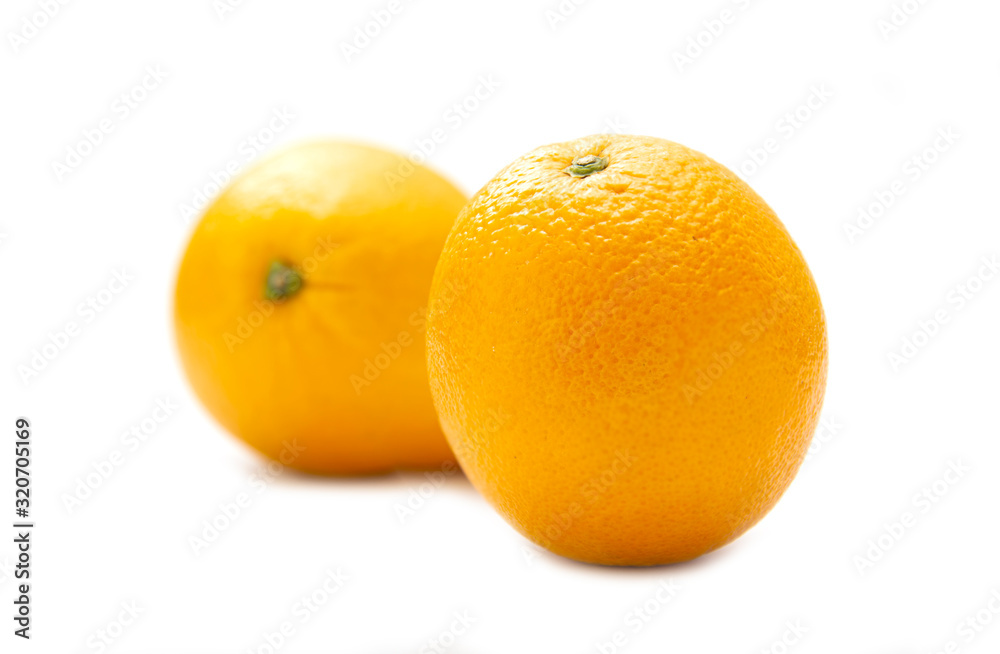 Two organic ripe fresh oranges isolated on white background Two organic ripe fresh oranges isolated on white background
