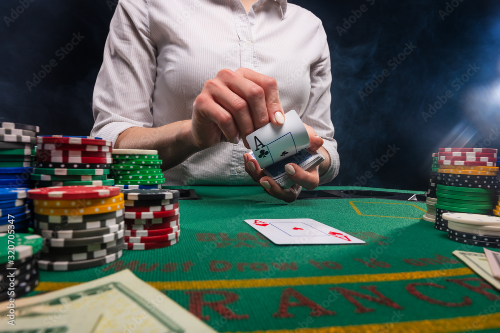 Playing poker in a casino, dealing with croupiers with cards. Money and success.