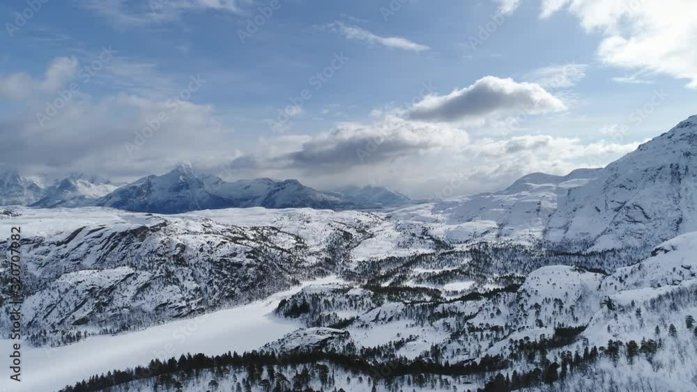 Arctic Winter Landscape with Frozen Lake Woods and Mountains Arctic Winter Landscape with Frozen Lake Woods and Mountains