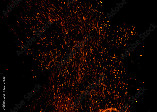 flame of fire with sparks on a black background