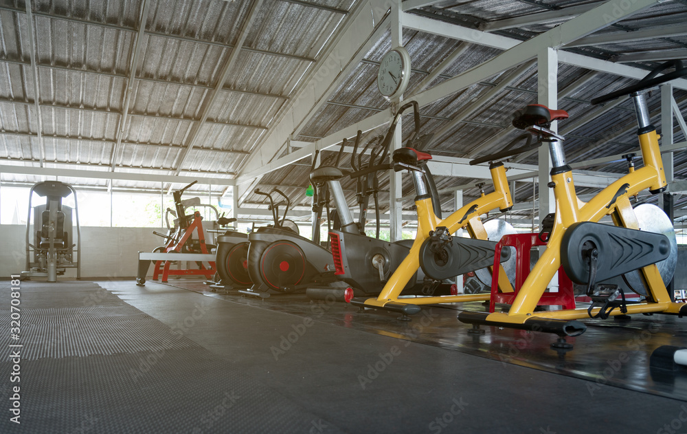 fitness club with equipment, gym for exercise and weight training, body transfomation