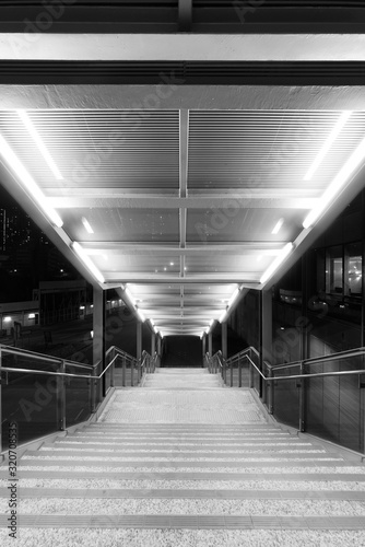 Fototapeta Naklejka Na Ścianę i Meble -  Stairway of modern pedistrican walkway at night