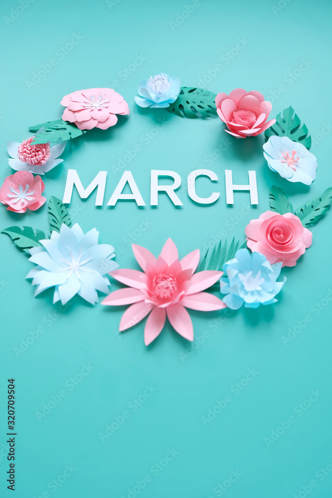 Hello, spring. With pink and blue paper flowers and green leaves