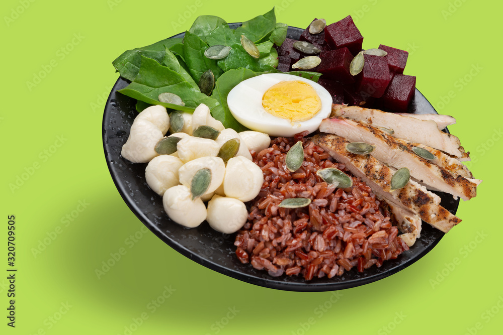 Foto Stock bowl with healthy diet food, healthy lifestyle concept,  vegetables, kenua porridge, and mozzarella, bowl levitate | Adobe Stock