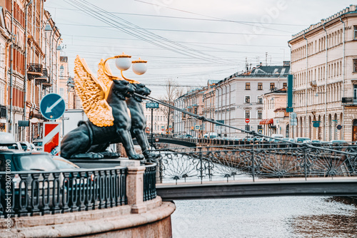 Bank Bridge is decorated with figures of griffins. Urban View of Saint Petersburg. Russia.