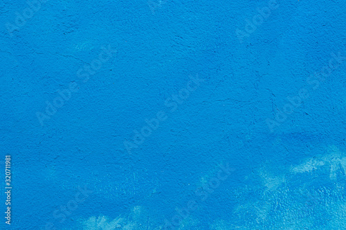 Beautiful blue stucco wall background with decorative space