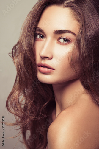 Portrait of a beautiful girl with natural makeup. Beauty style shot. Clean skin and hair. Close up.