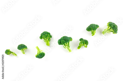 Broccoli florets, overhead shot on a white background with copy space
