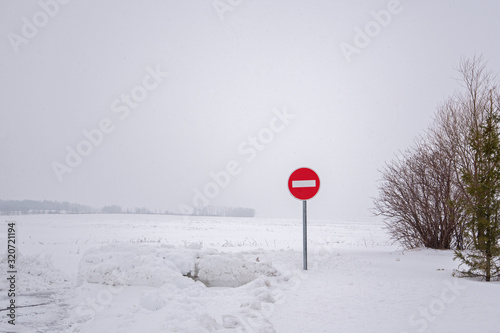 road stop sign on the background of snow