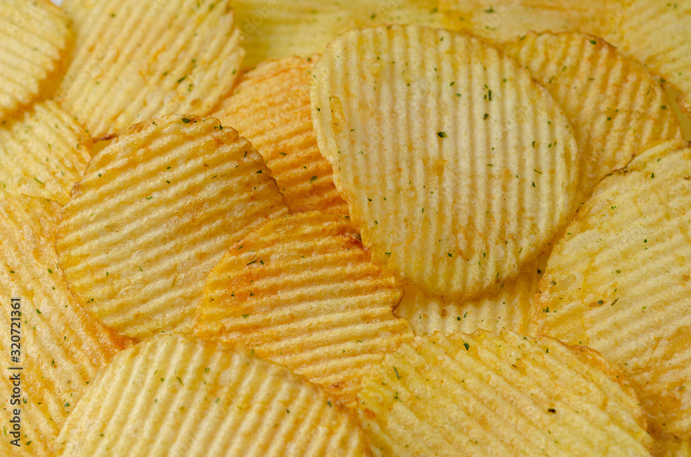 Background with appetizing potato chips Background with appetizing potato chips