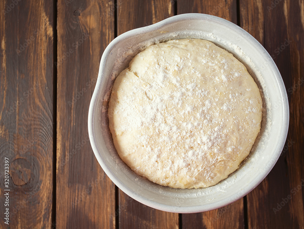 yeast dough on dark wooden surface yeast dough on dark wooden surface