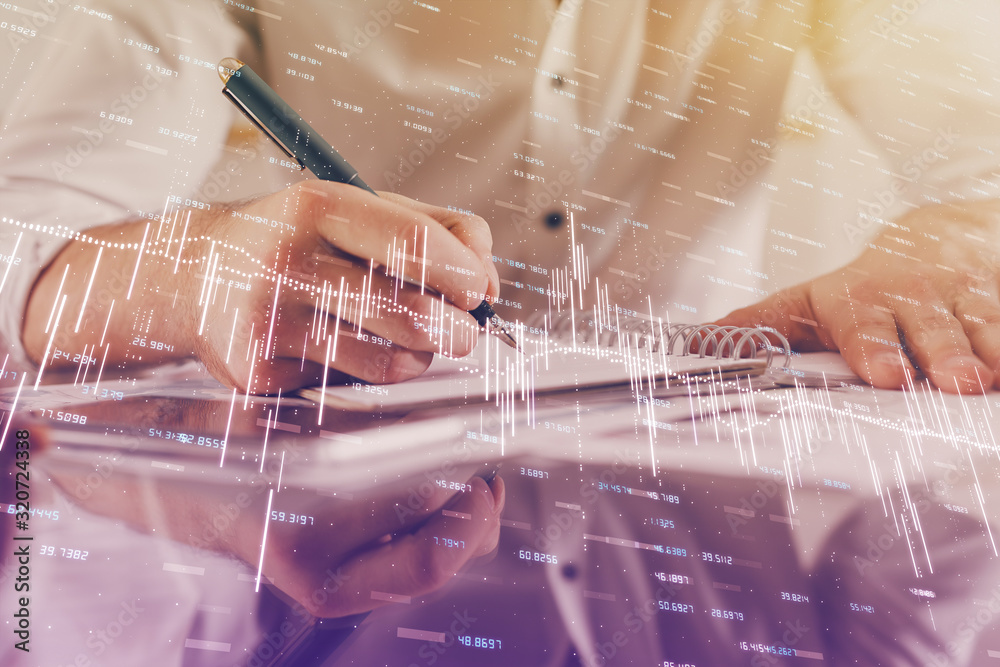 Multi exposure of man planing investment with stock market forex chart. Multi exposure of man planing investment with stock market forex chart.