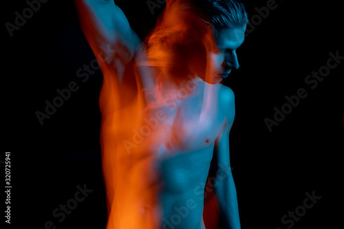 man with naked torso long exposure portrait. Landscape orientation. Ghost. abstract conceptual artistic view. representation of subconscious feelings, doubts and thoughts. complimentary teal orange